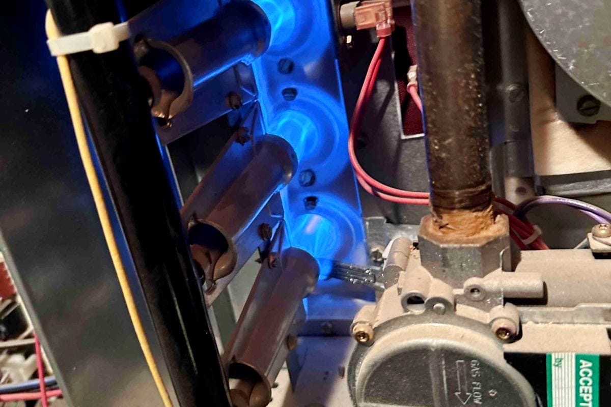 Gas furnace burners operating during a heating cycle